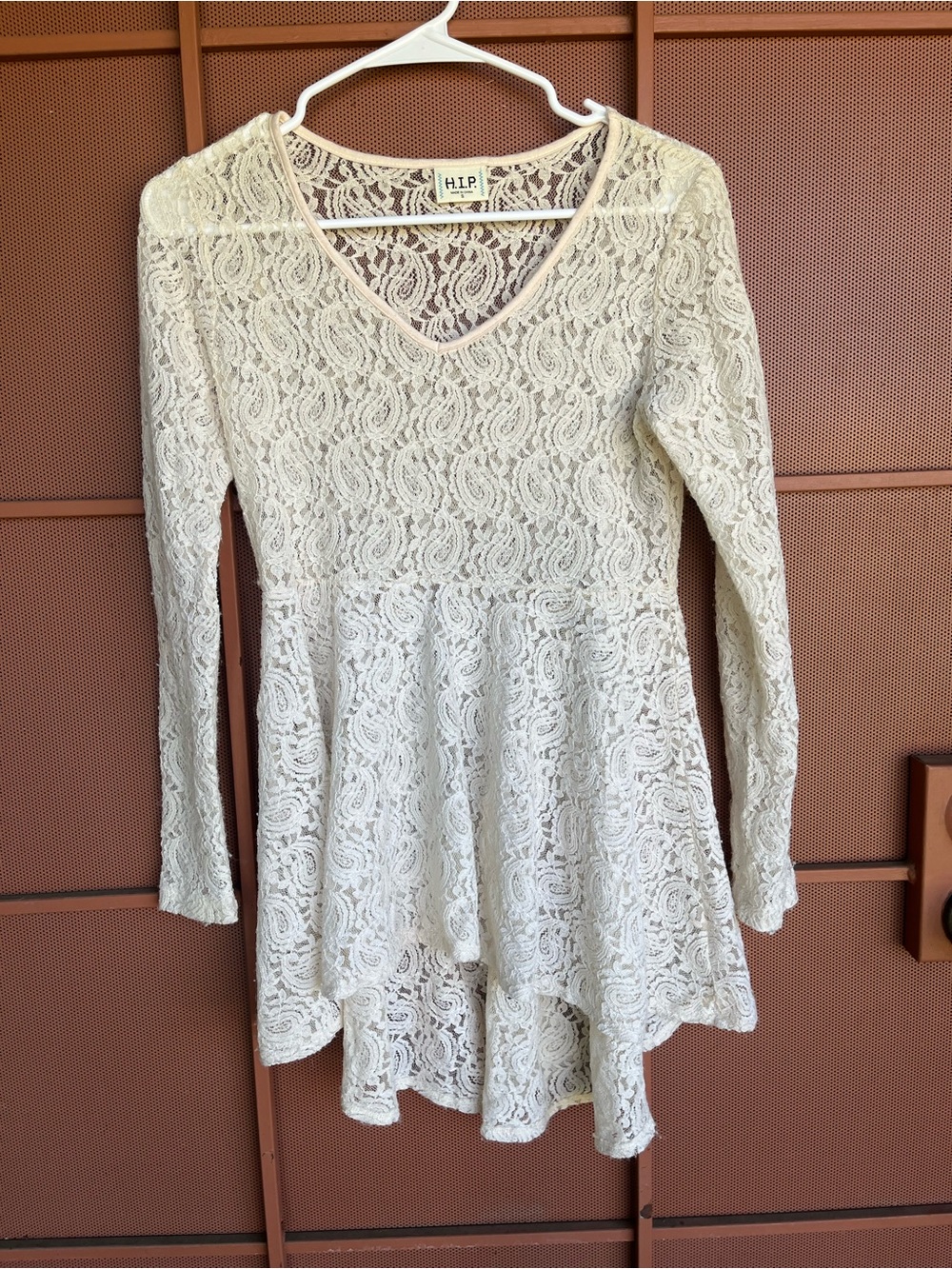 h.i.p. Cream Lace V-Neck Peplum Tunic has some stretch for comfort